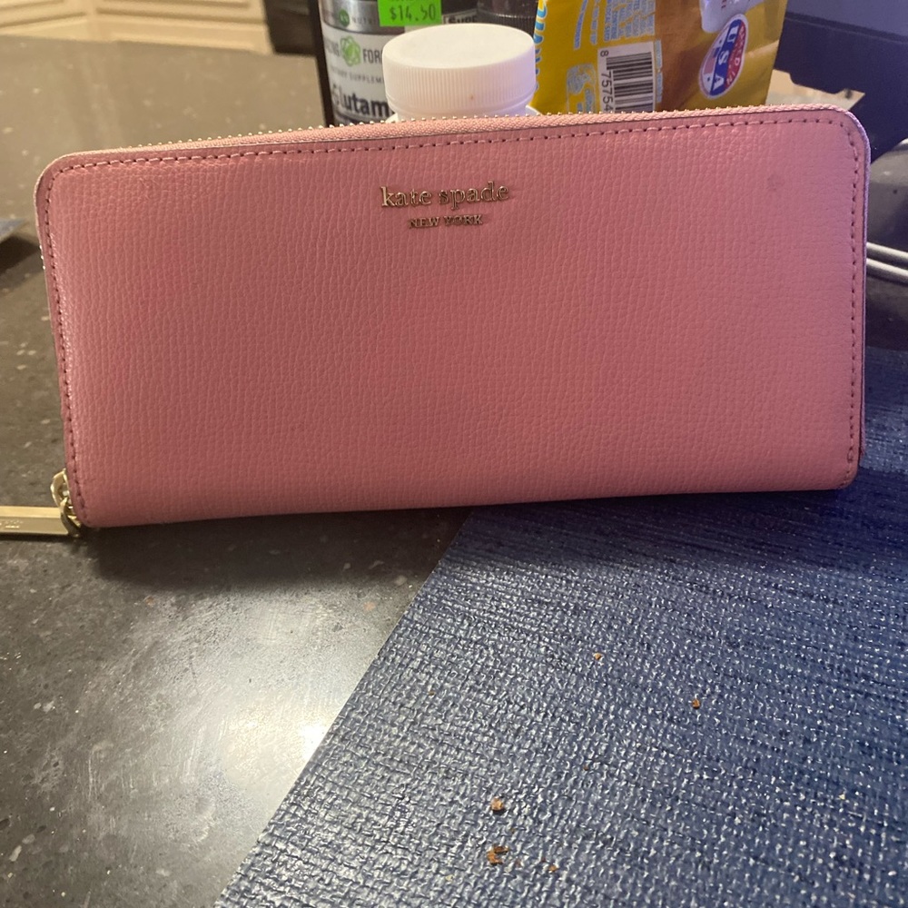 Ladies pink wallet.